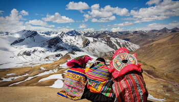 Andes Mountains: Three Andean people bundled up from the cold.