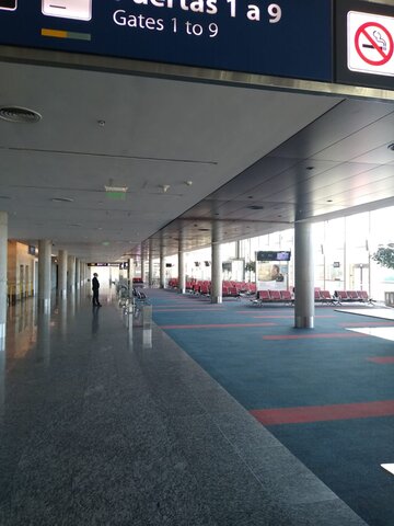 passenger waits in empty terminal at Ezeiza International Airport 