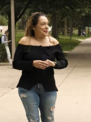 Professor Felisa Vergara Reynolds walks on the Quad